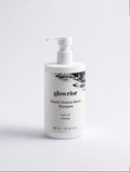 A white pump bottle of glowrior Keratin Volume Boost Shampoo on a light gray background.